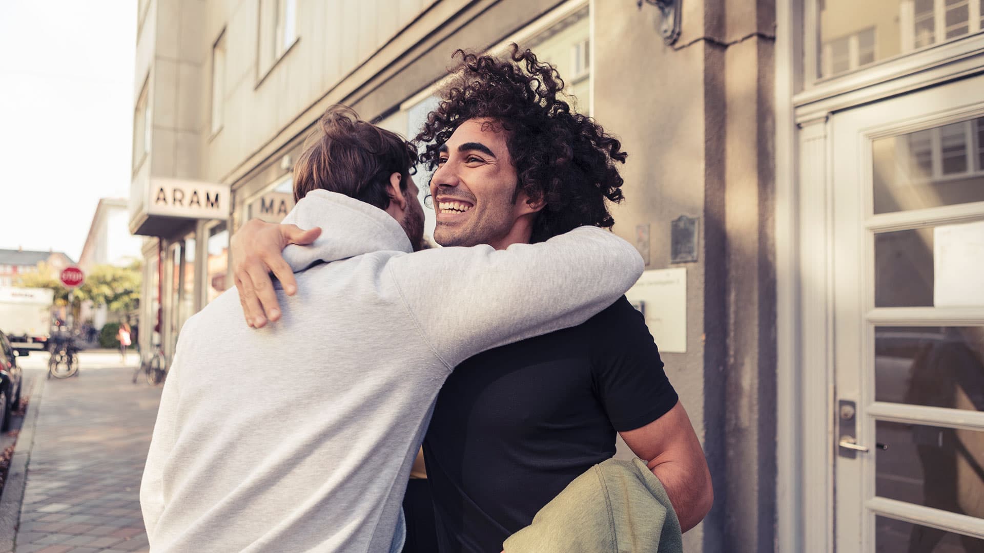 Friends hugging and smiling